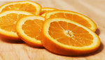 Free Stock Photo: Orange slices on a cutting board
