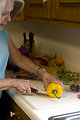 Free Stock Photo: A woman preparing a salad in her kitchen
