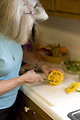 Free Stock Photo: A woman preparing a salad in her kitchen