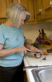 Free Stock Photo: A woman preparing a salad in her kitchen
