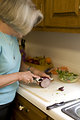 Free Stock Photo: A woman preparing a salad in her kitchen