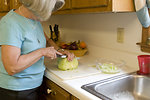 Free Stock Photo: A woman preparing a salad in her kitchen