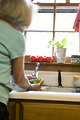 Free Stock Photo: A woman preparing a salad in her kitchen