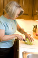 Free Stock Photo: A woman preparing a salad in her kitchen