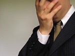 Free Stock Photo: Closeup of business man burying head in hand