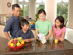 Free Stock Photo: An Asian family eating dinner at a table