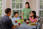 Free Stock Photo: An Asian family eating dinner at a table