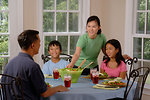 Free Stock Photo: An Asian family eating dinner at a table