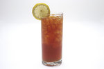 Free Stock Photo: A tall glass of iced tea with a lemon