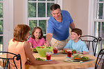Free Stock Photo: A family eating lunch at the kitchen table