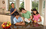 Free Stock Photo: An Asian family eating dinner at a table