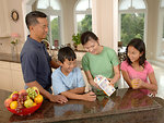 Free Stock Photo: An Asian family eating dinner at a table