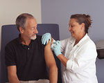 Free Stock Photo: A nurse administering a vaccine to a male patient