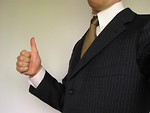Free Stock Photo: Business man in suit giving thumbs up