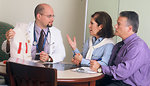 Free Stock Photo: A doctor and couple talking
