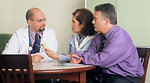 Free Stock Photo: A doctor and couple talking