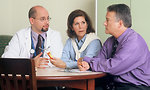 Free Stock Photo: A doctor and couple talking