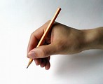 Free Stock Photo: Closeup of a hand holding a pencil