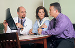 Free Stock Photo: A doctor and couple viewing an x-ray