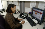 Free Stock Photo: An African American woman working at her desk