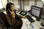 Free Stock Photo: An African American woman working at her desk