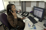 Free Stock Photo: An African American woman working at her desk