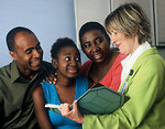 Free Stock Photo: A female doctor consults with a family
