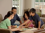 Free Stock Photo: A family playing a board game
