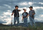 Free Stock Photo: Three young boys with fishing poles