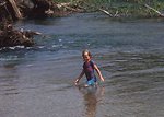 Free Stock Photo: A young girl playing in a stream