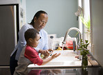 Free Stock Photo: A young boy learning how to wash his hands