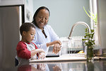 Free Stock Photo: A young boy learning how to wash his hands