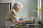 Free Stock Photo: An elderly woman washing produce