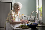 Free Stock Photo: An elderly woman washing produce