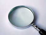 Free Stock Photo: Magnifying glass on a white background