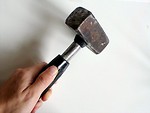 Free Stock Photo: Hand holding a worn mallet