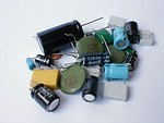 Free Stock Photo: Small pile of various capacitors