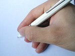 Free Stock Photo: Closeup of hand holding a pen.