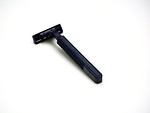 Free Stock Photo: Black plastic razor on white background