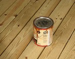 Free Stock Photo: Can of wood stain on wooden deck