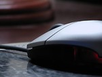 Free Stock Photo: Closeup of a computer mouse on a mousepad