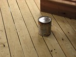 Free Stock Photo: Can of wood stain on a wooden deck