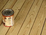 Free Stock Photo: Can of wood stain on a wooden deck