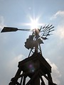 Free Stock Photo: An old farm windmill shining under the sun