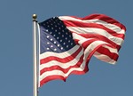 Free Stock Photo: US flag flying in a blue sky
