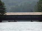 Free Stock Photo: A covered bridge spanning a lake