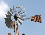 Free Stock Photo: An old farm windmill in a blue sky