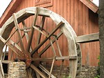 Free Stock Photo: Side view of a red bar with a dry water wheel