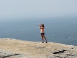 Free Stock Photo: Woman tourist taking a photo on top of Stone Mountain
