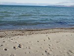 Free Stock Photo: Distant mountains across the ocean from the beach